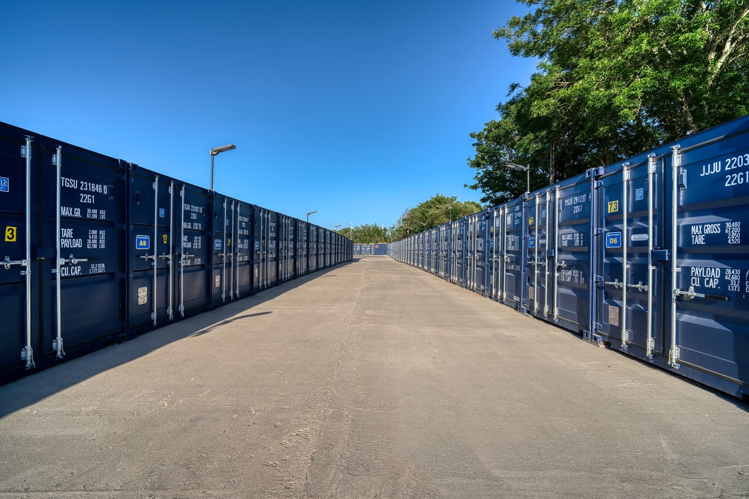Rows of affordable drive-up storage containers along the main access lane in Henbury